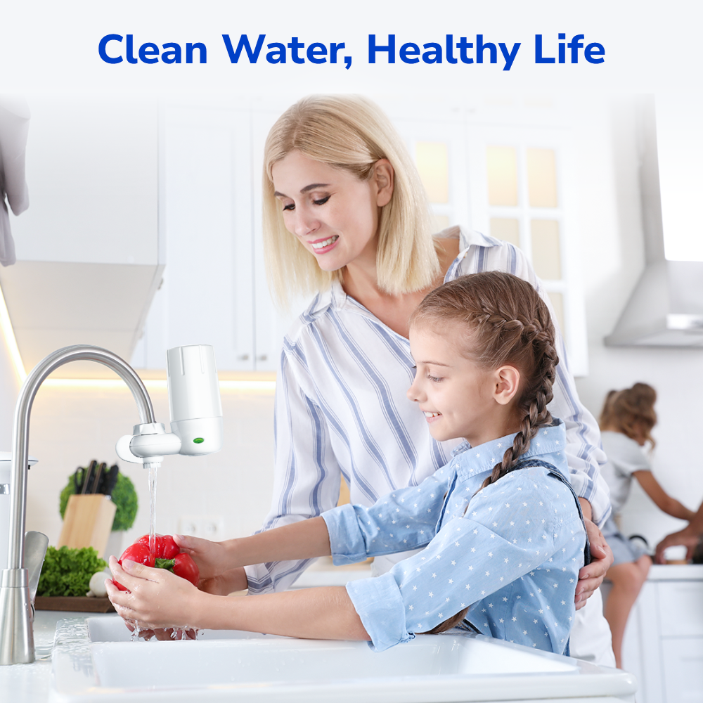 Mother and daughter preparing vegetables together at the sink with clean water using Fil-Fresh faucet filter replacement