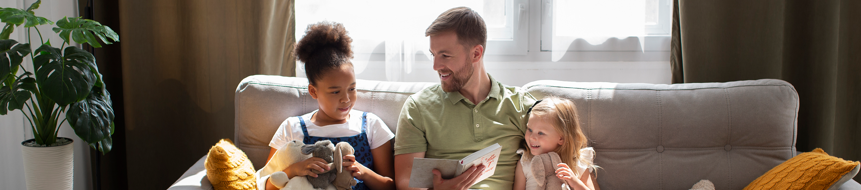 Father and daughters are having fun at home while using Fil-Fresh air purifier filter replacement