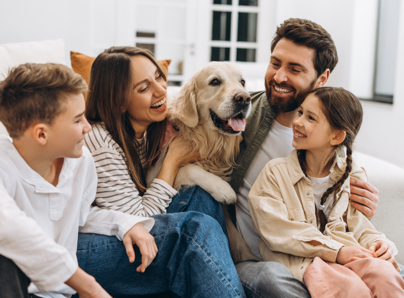 Family and dog enjoying a clean, cozy home with Fil-Fresh filter products for a healthy lifestyle
