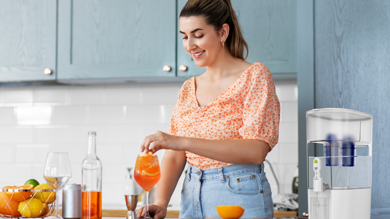Young woman making drinks with water filtered by a Fil-Fresh replacement filter