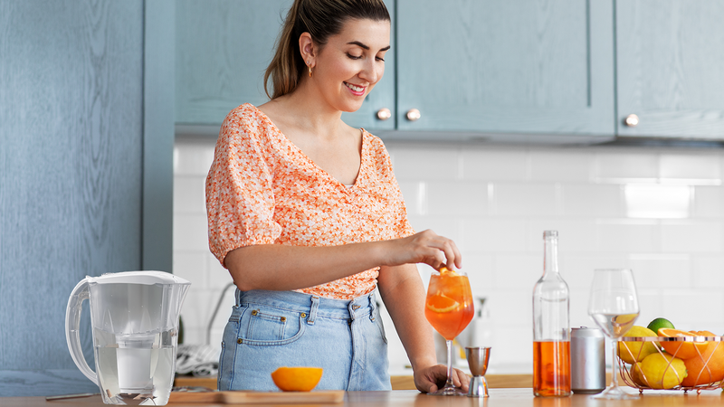 Young woman making drinks with water filtered by a Fil-Fresh replacement filter