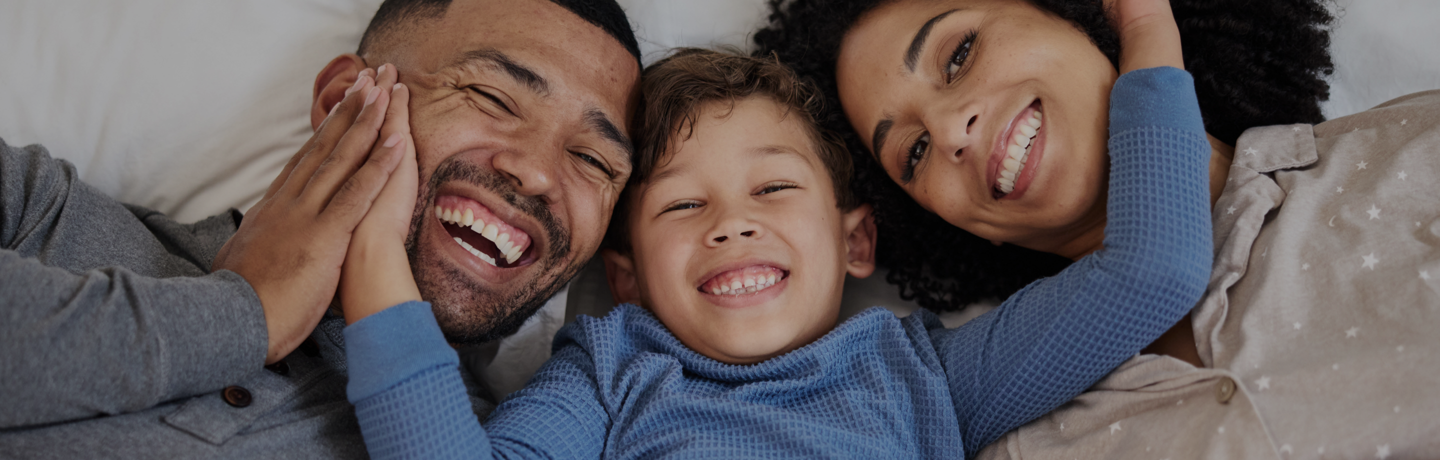 Bright smiles from one of the many families who trust Fil-Fresh, lying close together