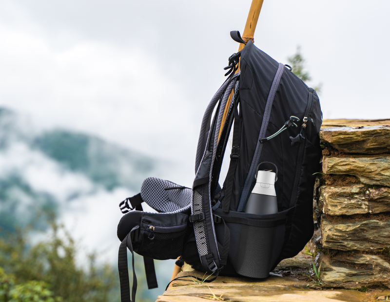Outdoor hiking equipment and backpack with water bottle featuring Fil-Fresh water bottle filter in the side pocket