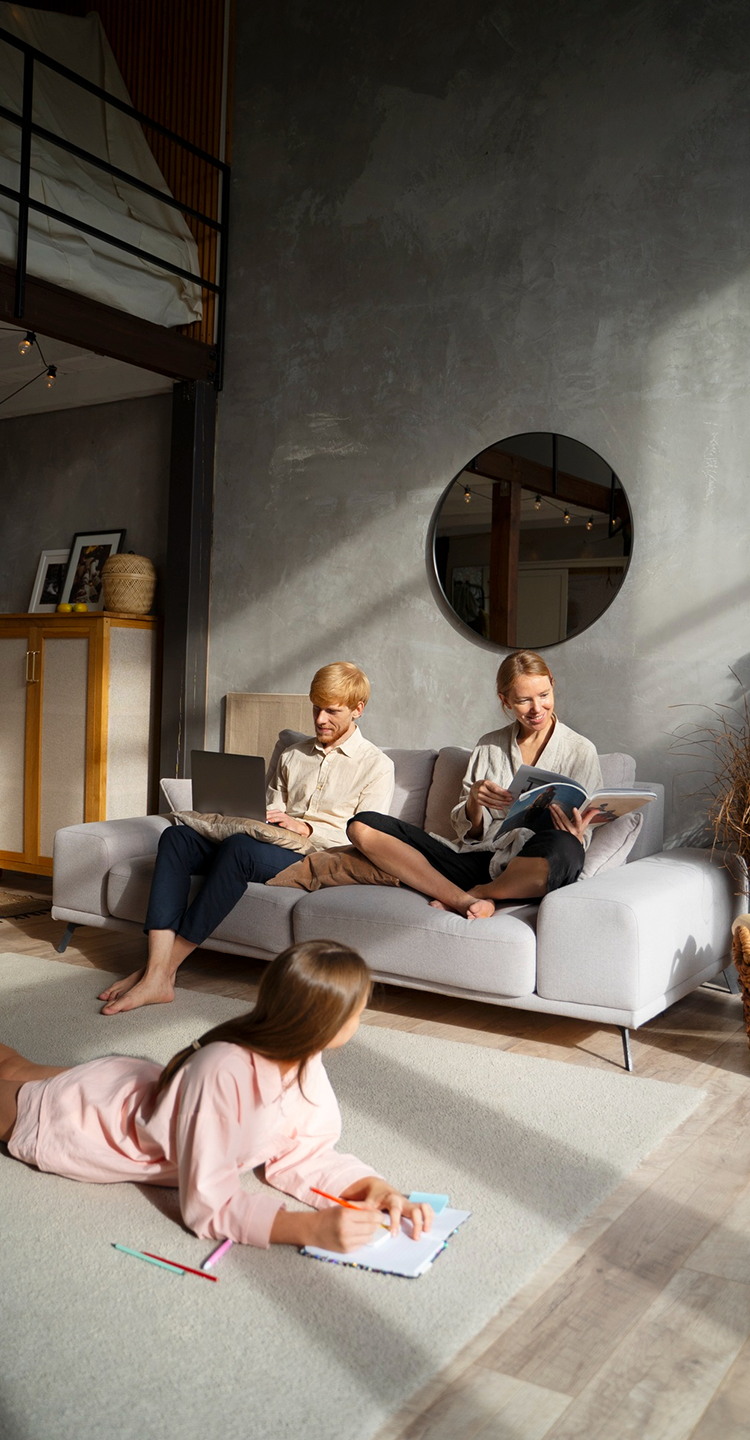 Parents reading while their daughter watches in a fresh, peaceful home
